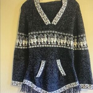 Cozy Black and White Sweater with Fringe